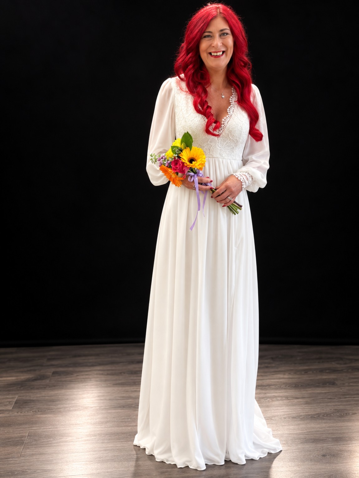 Julie modelling a white occasion dress with flowers